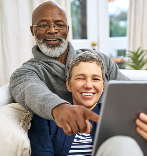 senior couple looking at a computer together