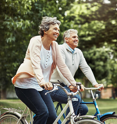 senior couple riding bikes together