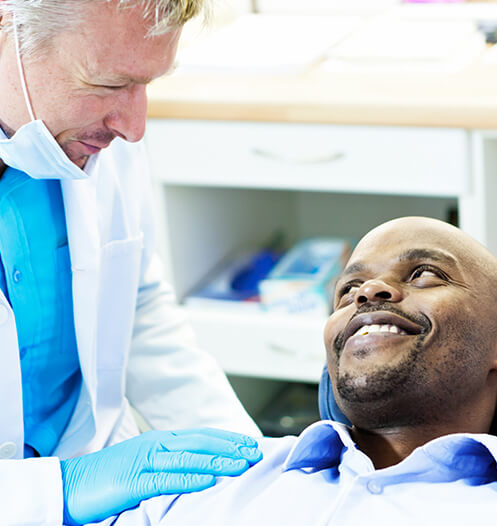 dentist comforting a patient