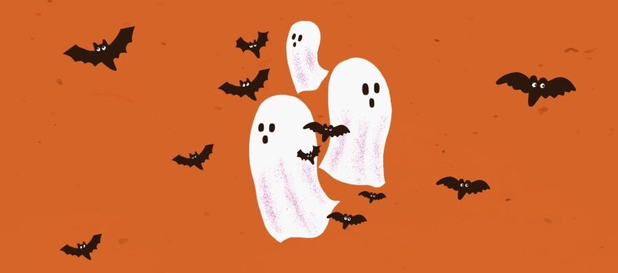 White ghosts and black bats float on an orange background for Halloween