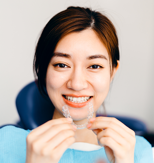 woman with clear aligner