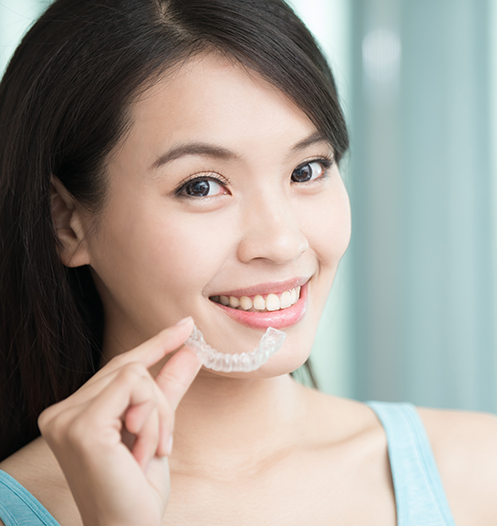 woman with clear aligner